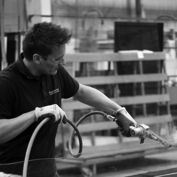 Award winning wayfinding design - glass sign being cut